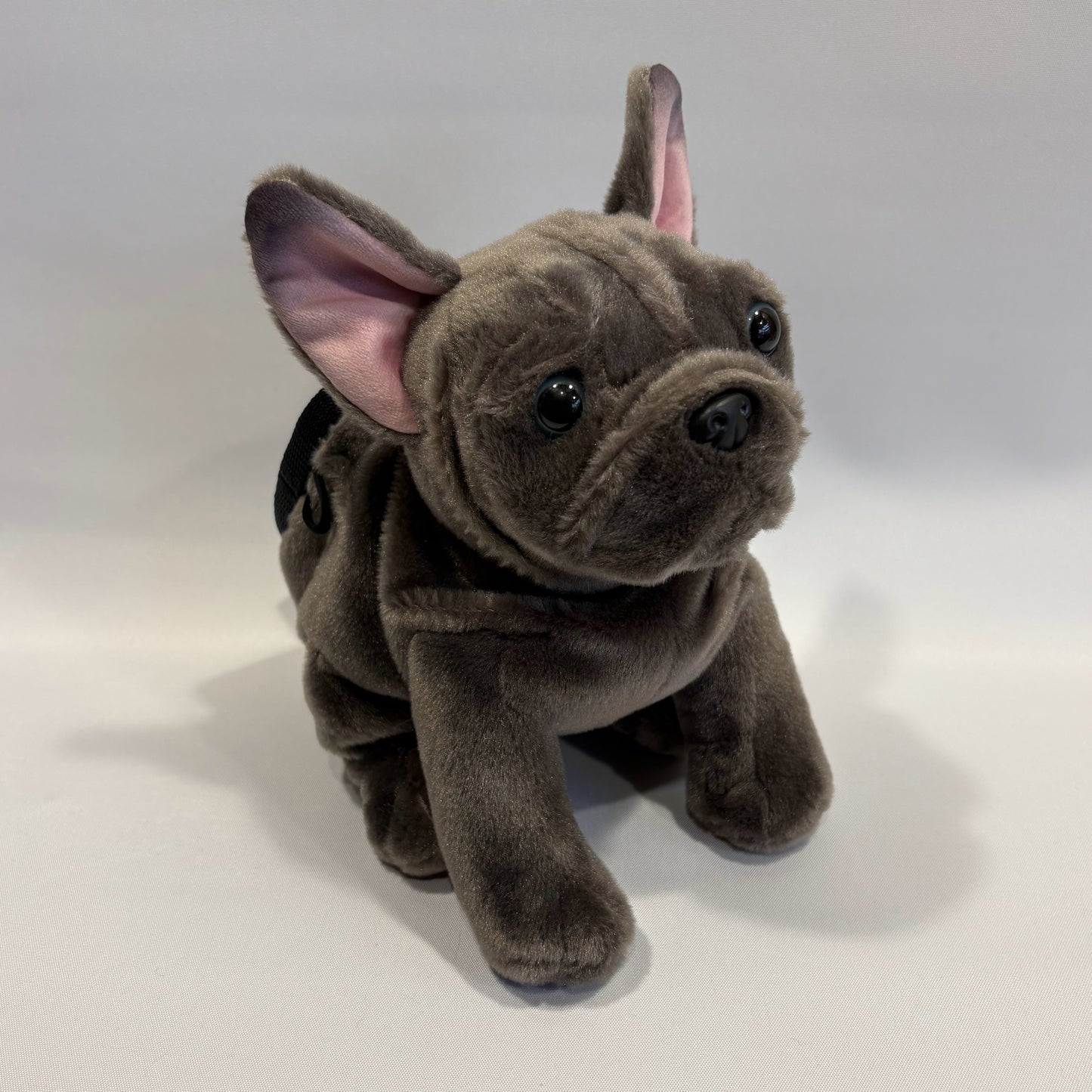 Grey boxer dog plush rock climbing chalk bag, showcasing unique climbing gear, on a white background