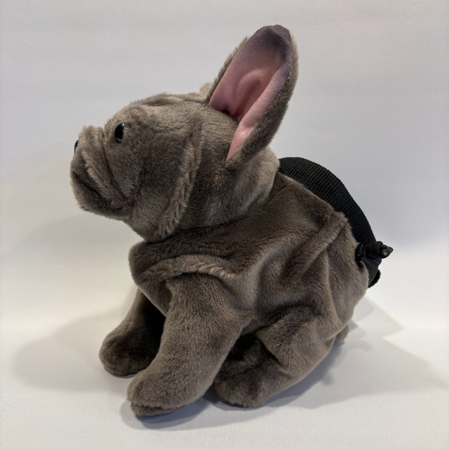 Grey boxer dog plush rock climbing chalk bag, viewed side on, on a white background