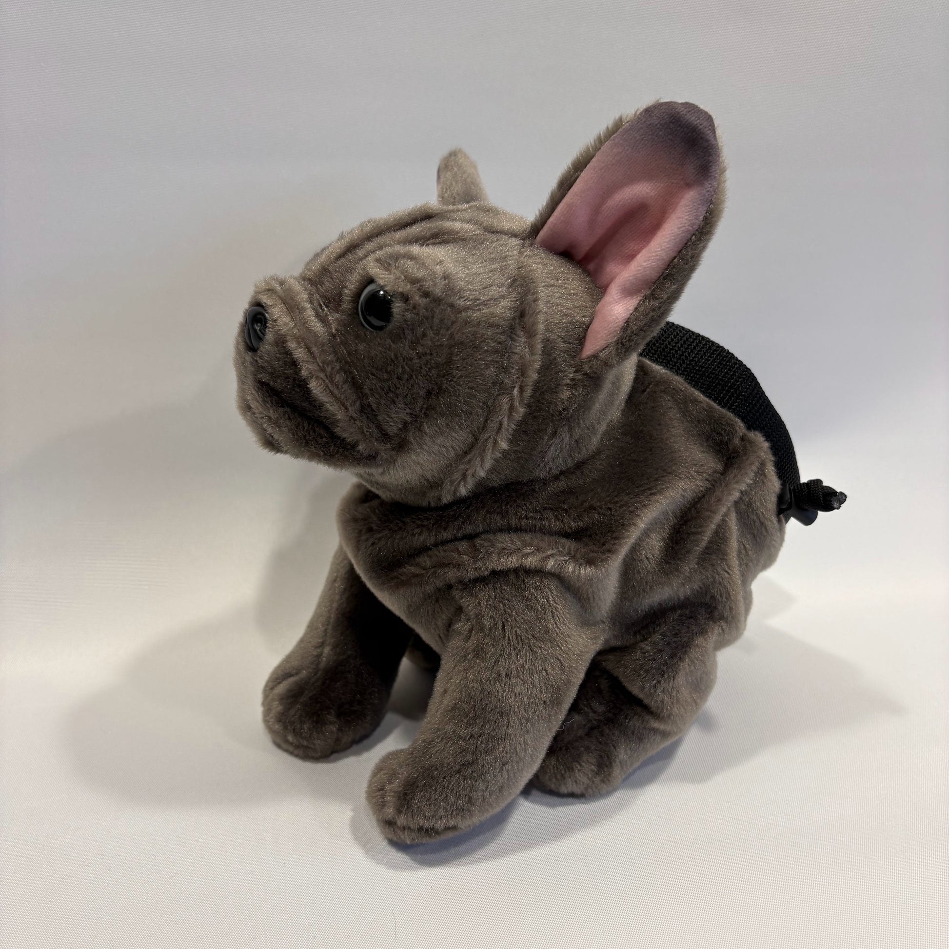 Grey boxer dog plush rock climbing chalk bag, showcasing unique climbing gear, on a white background