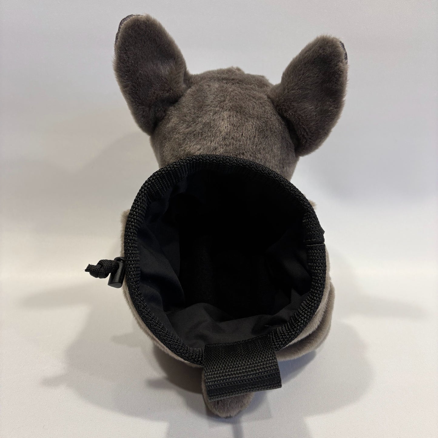 Grey boxer dog plush rock climbing chalk bag, showing rear view and opening of the chalk bag on a white background