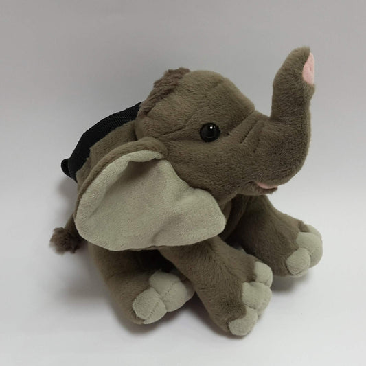 Plush elephant chalk bag made from a soft toy, with a grey body and trunk, light grey feet, black drawstring closure, and a webbing loop at the top, designed for rock climbing or bouldering use.